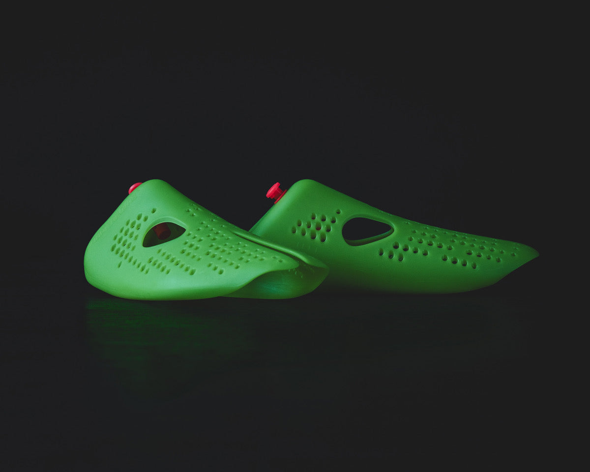 Odor-removing shoe insert for smelly shoes displayed in a sleek, modern design with a vibrant green color.
