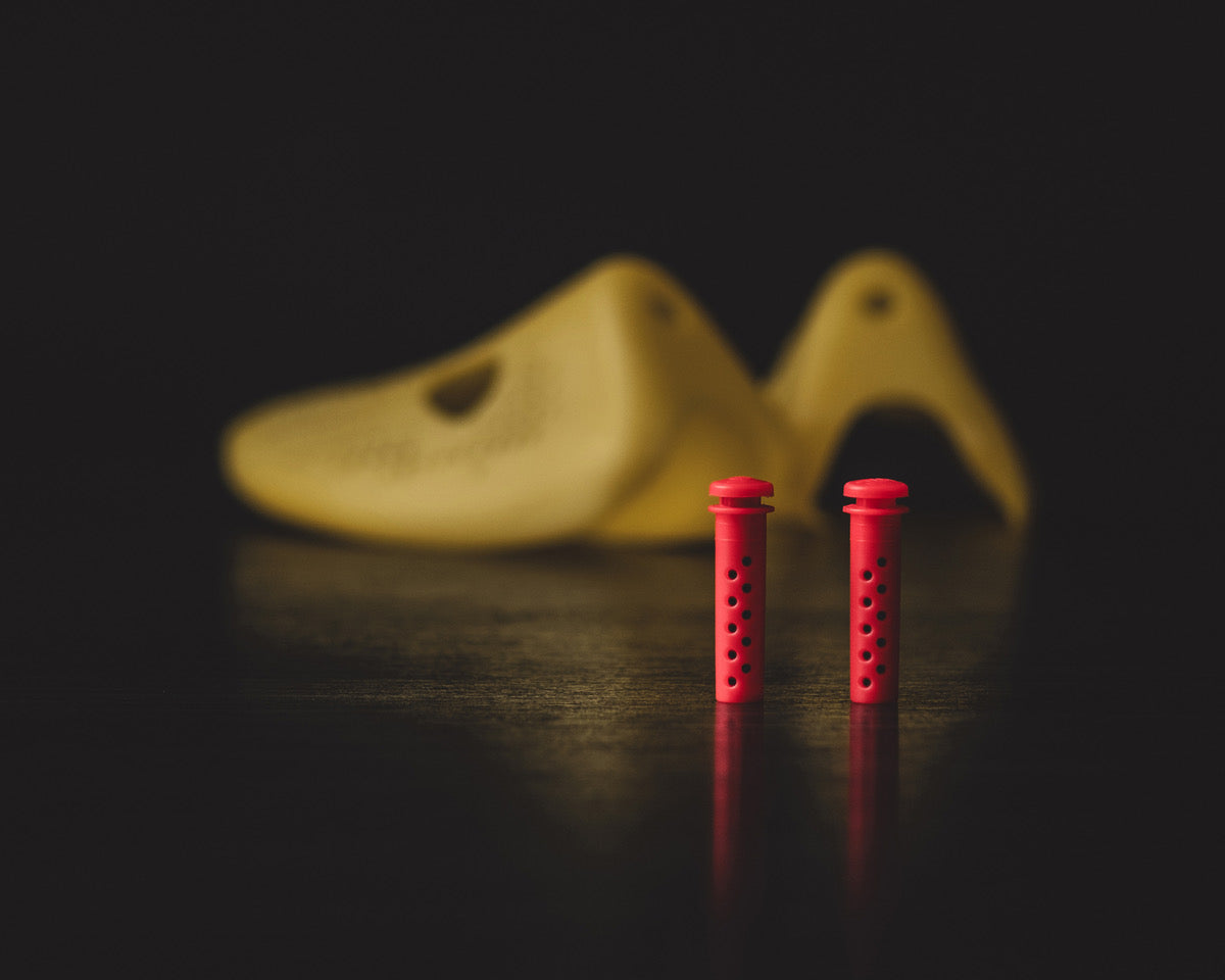 Odor Remover shoe insert in red, designed to eliminate odors from smelly shoes effectively.