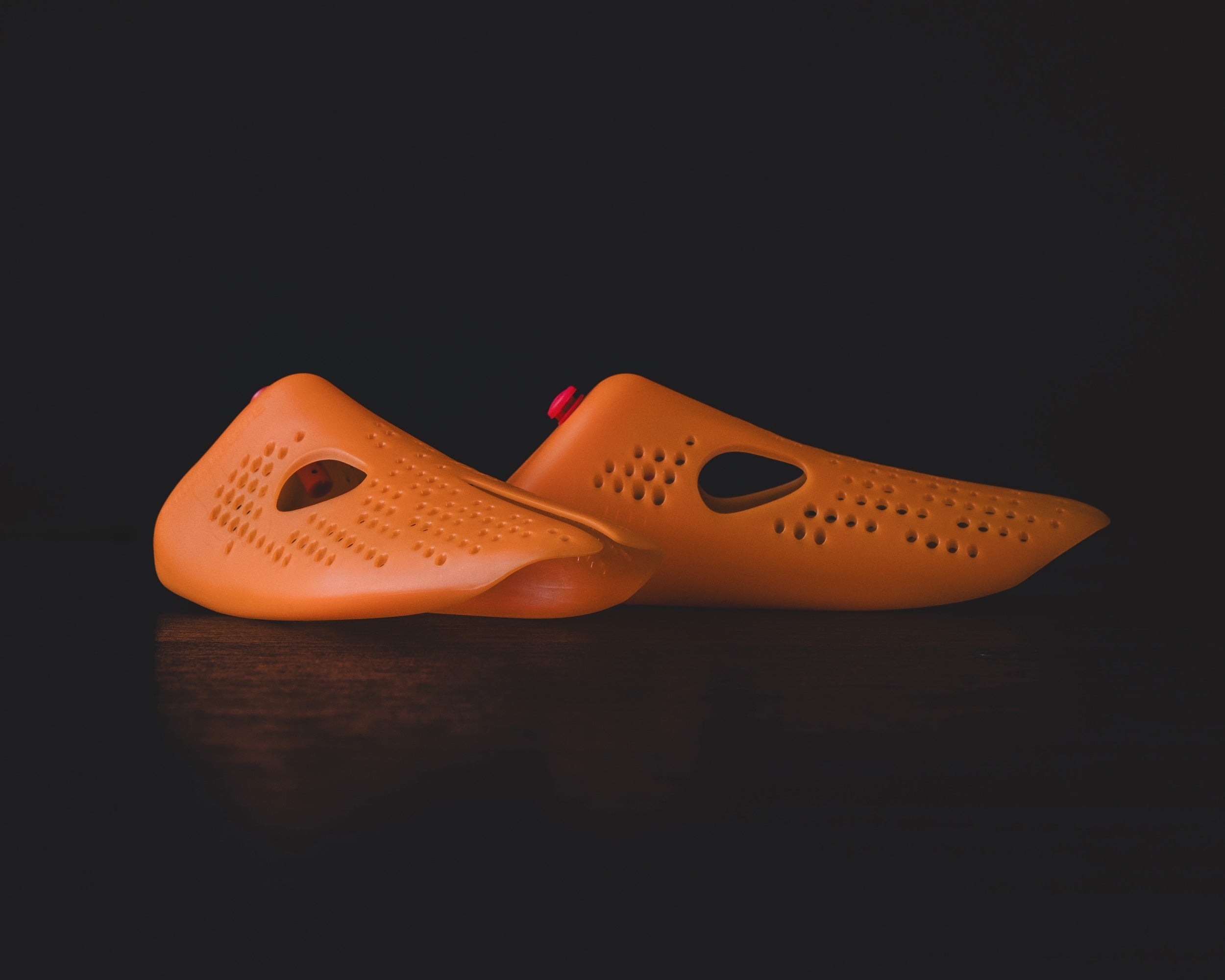 Odor Removing Shoe Insert designed to keep sneakers fresh and odor-free, showcasing an innovative orange shoe insert.