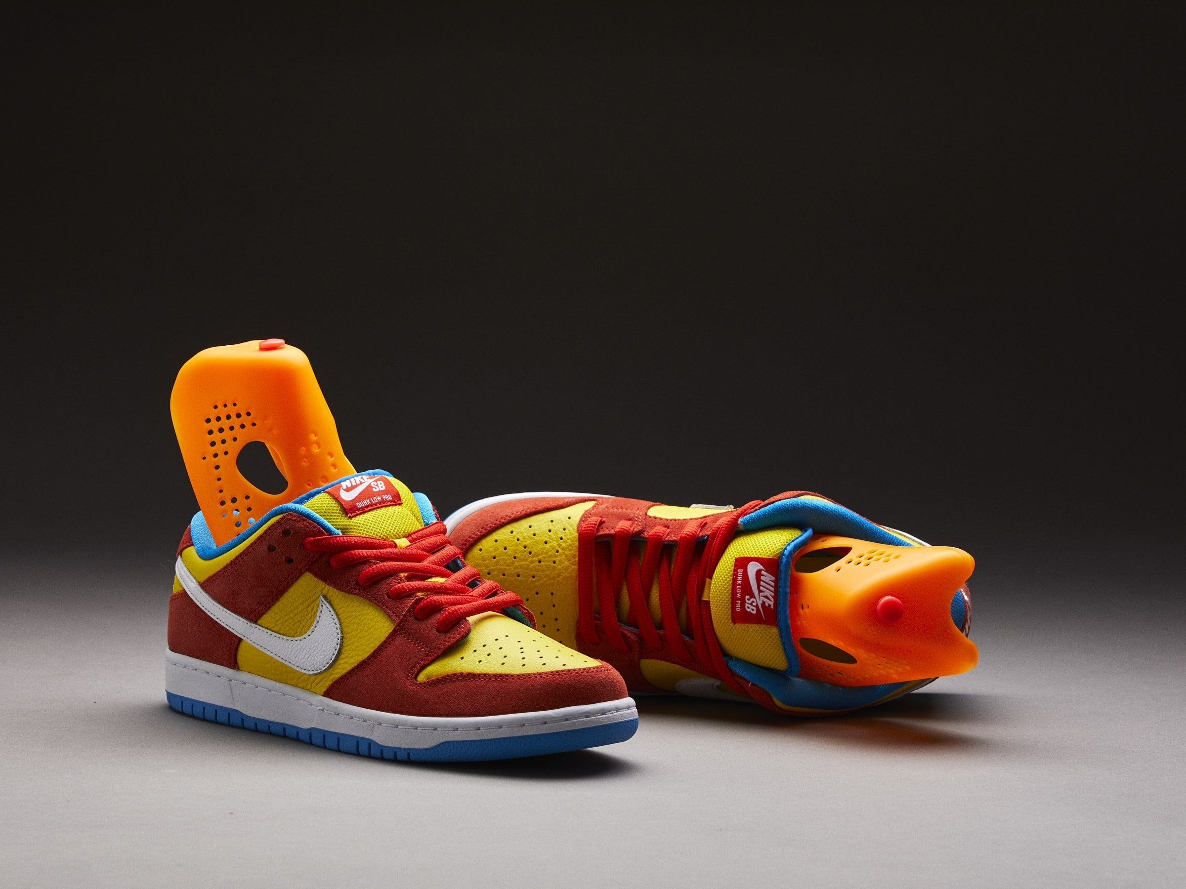 Colorful Nike sneakers with vibrant yellow shoe inserts designed to combat odors, showcasing Stinky Sneakers solution.