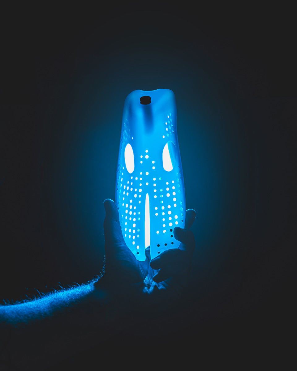 Shape Regime Smelly Sneakers solution glowing bottle design for odor elimination in footwear.